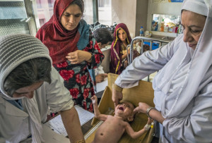 Nurses measure a baby to assess its nutritional status at Indira Gandhi Children's Hospital in Kabul, Afghanistan.